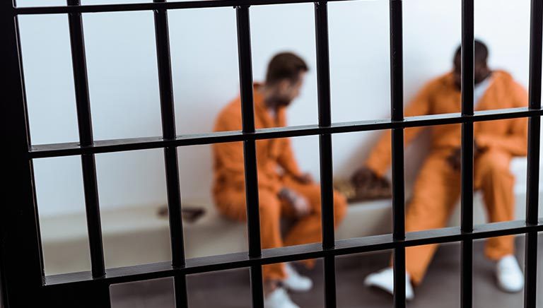 prisoners talking behind bars